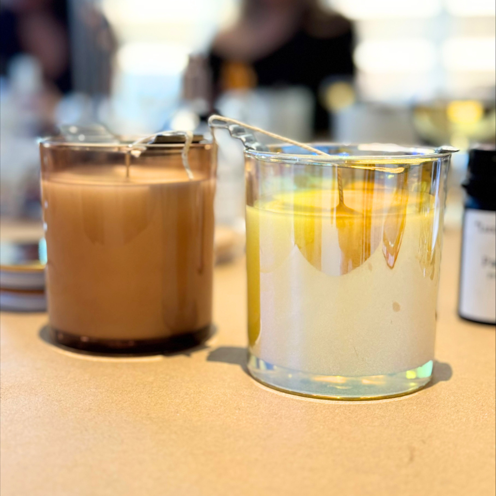 Guests pouring candles during a group candle making experience in Toronto studio